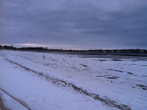 The beach covered in snow.